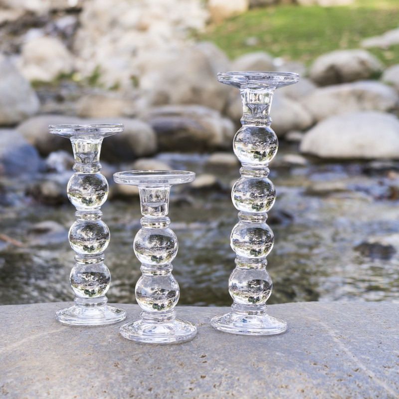 These ultra clear glass candlesticks feature a bubble chain pattern that is both playful and elegant!